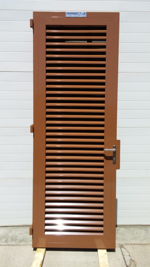 Powder coated louvered swing door. Kearney fence company fence contractors Nebraska powder coating protective durable sandblasting surface preparation etching sandblaster abrasive blasting precision